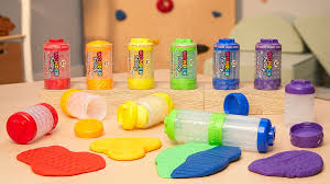 Child playing joyfully with colorful Never Dry Dough and Sand from the Wonder Factory, creating shapes during arts and crafts time.