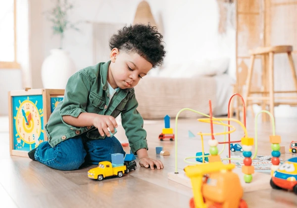 "Set of durable plastic building blocks in various shapes and primary colors."